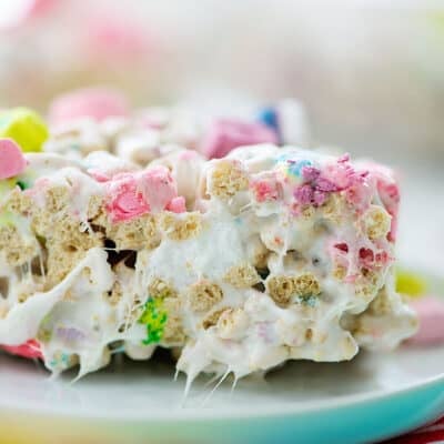 Lucky charms rice krispies treats on white plate.