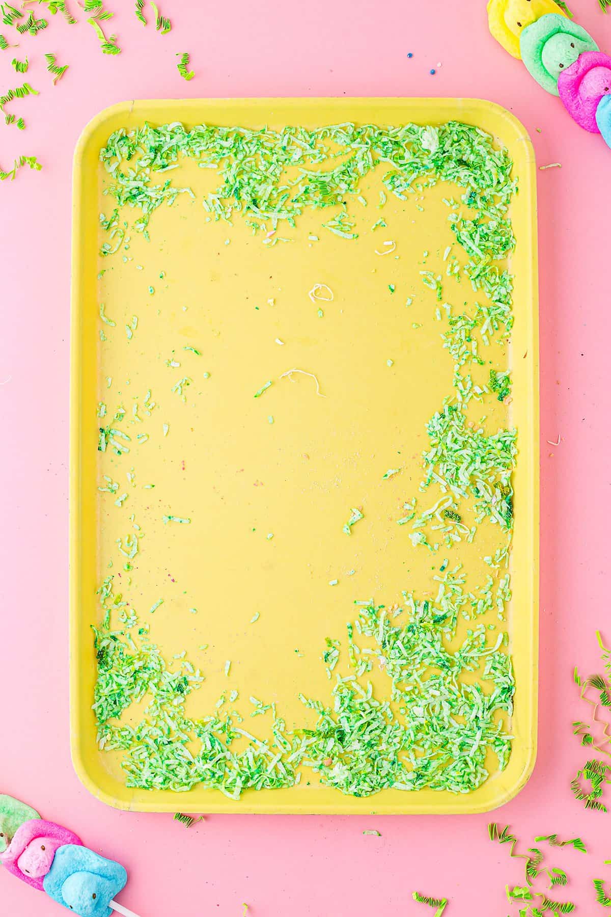 green coconut shreds on yellow board.