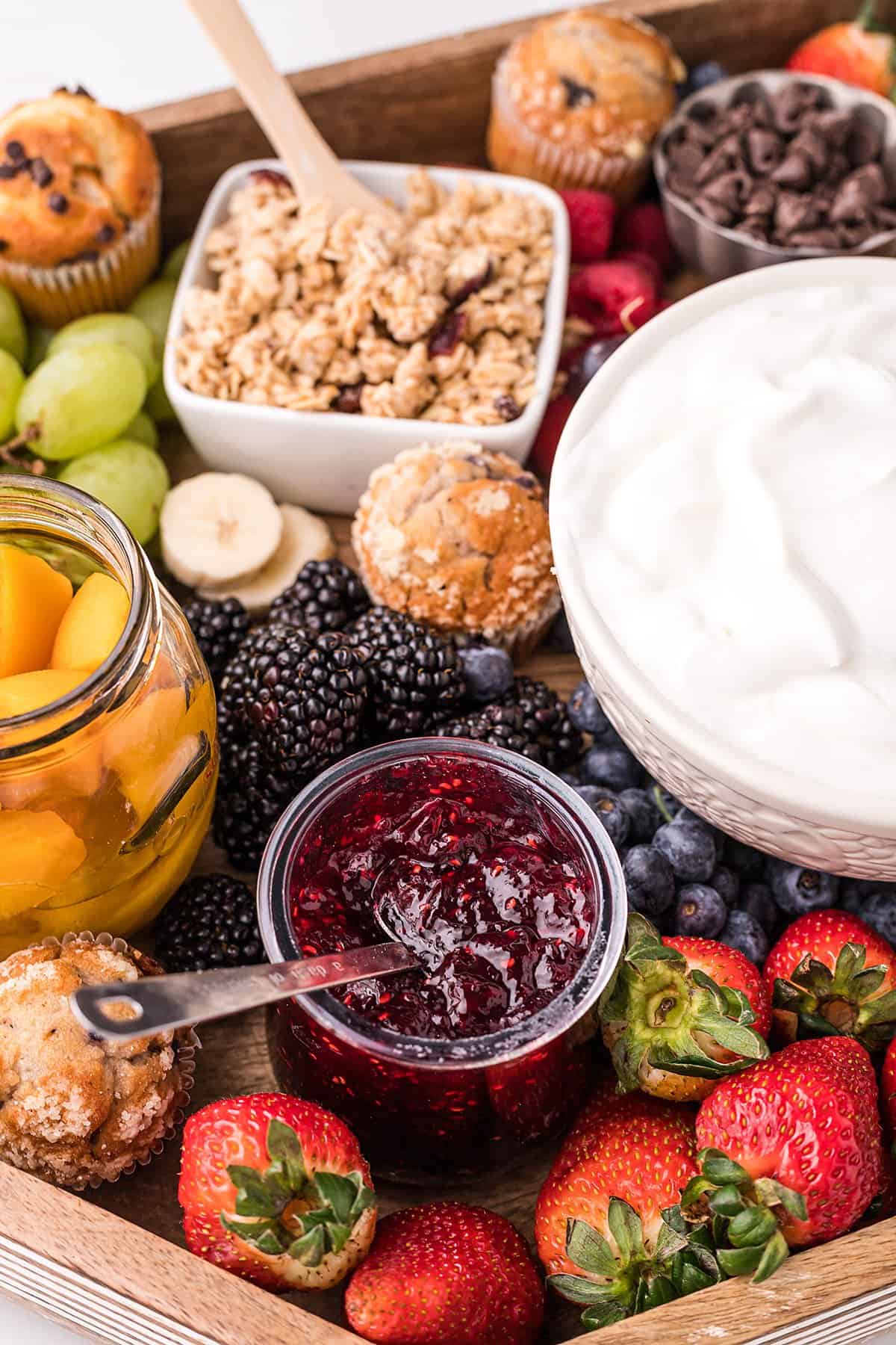 yogurt parfait board with fruit toppings.