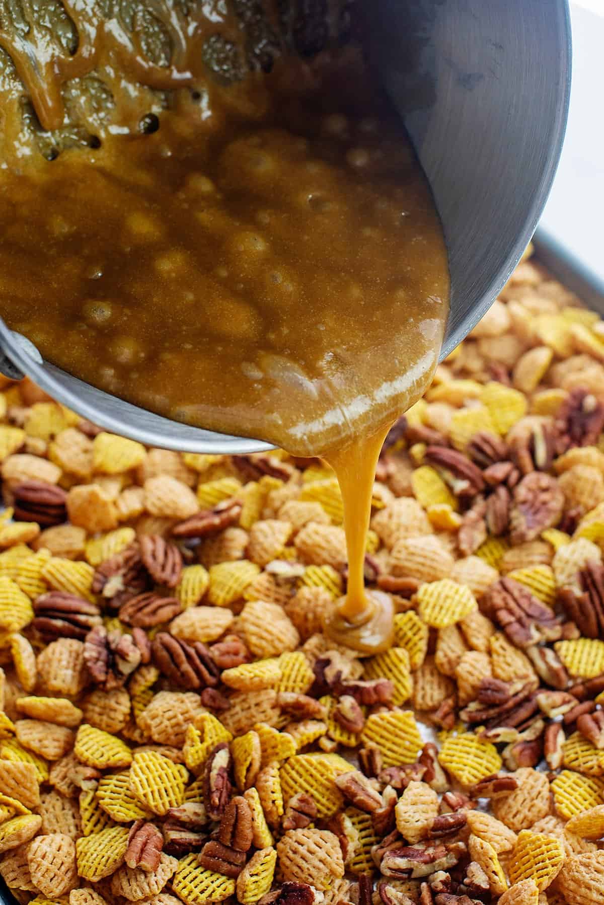 caramel sauce being poured over creal.