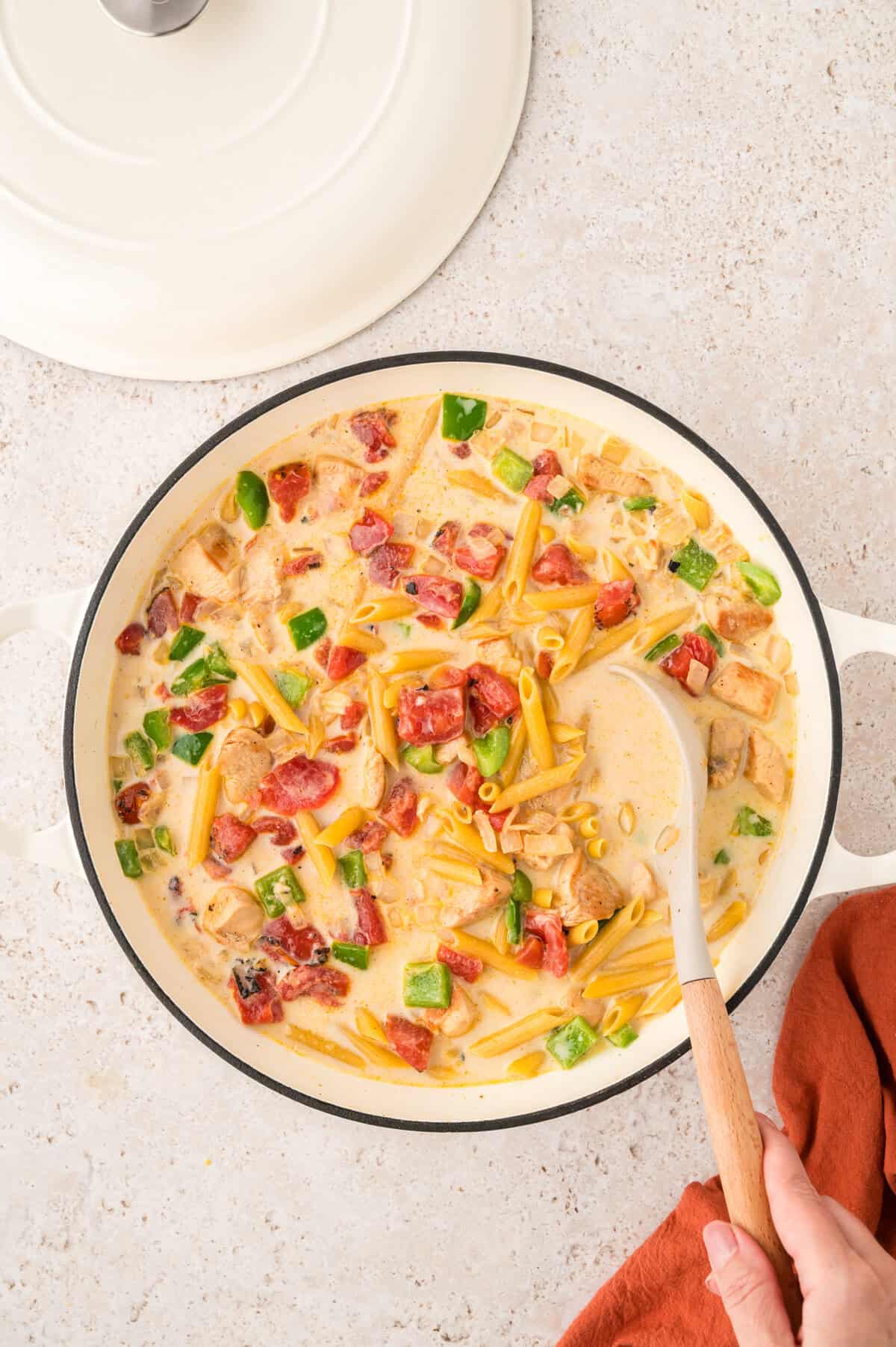 Skillet full of chicken and pasta.