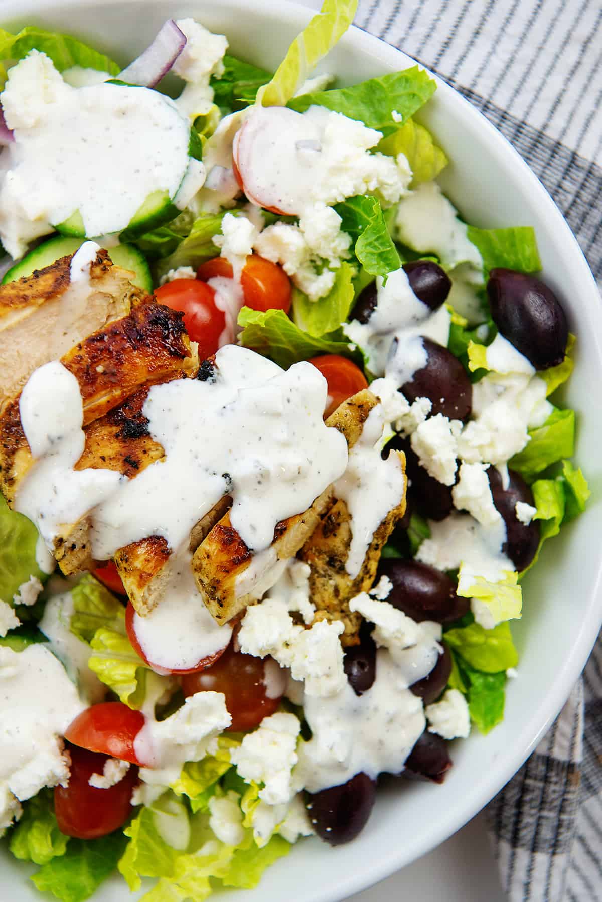 overhead view of salad with tzatziki dressing.