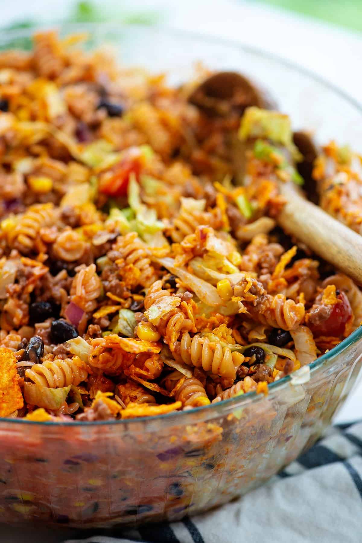taco pasta salad in glass mixing bowl.
