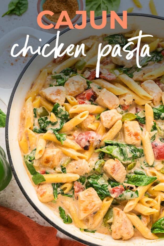 Cajun chicken pasta in white pot.