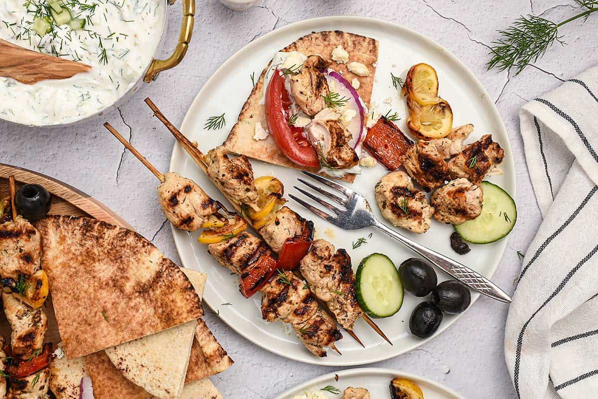 greek chicken kabobs on plate.