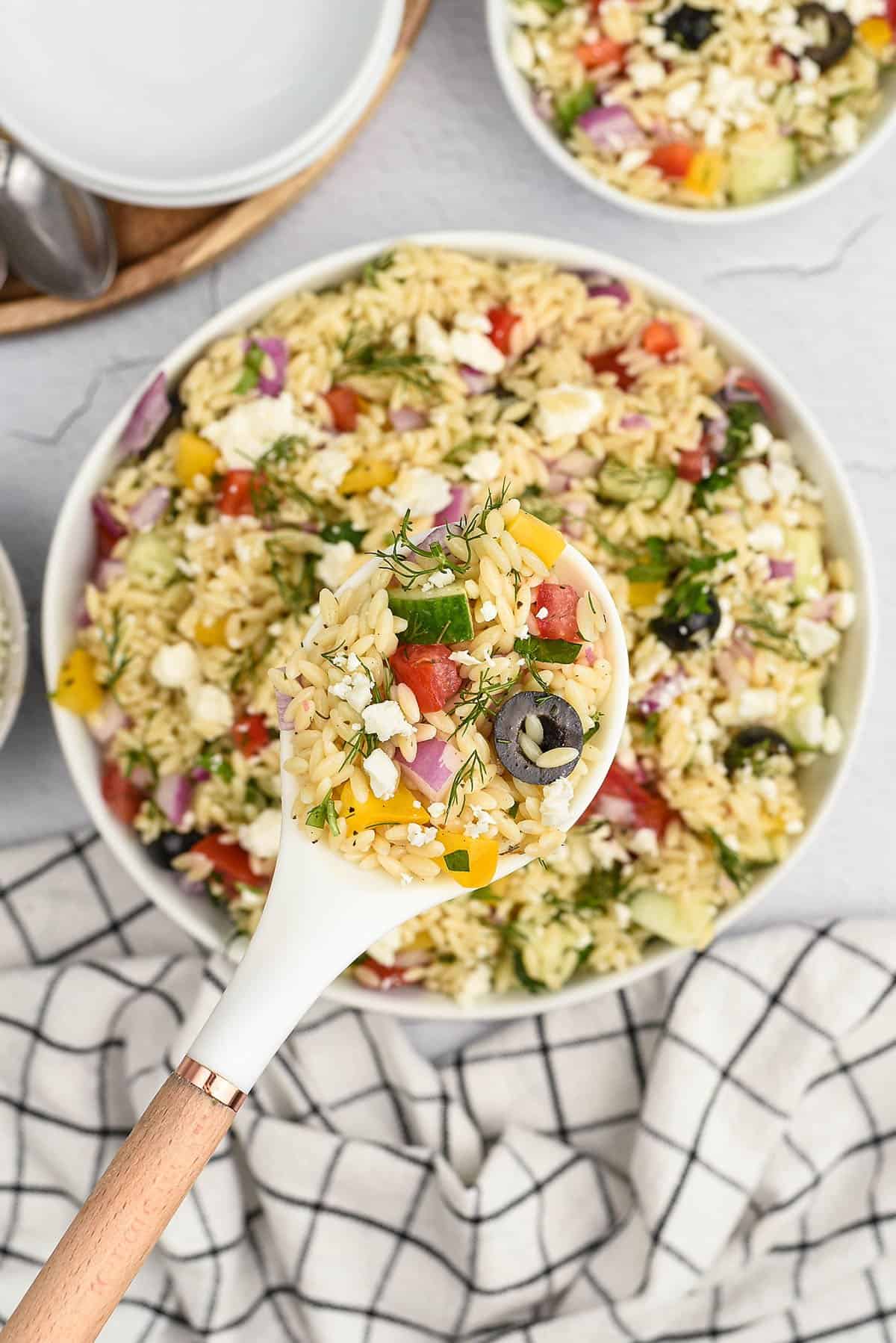 Greek orzo salad in bowl.