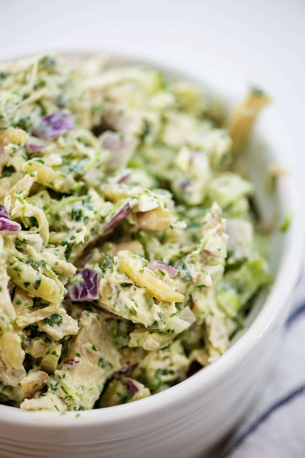 Bowl full of green goddess chicken salad.