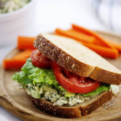 Green goddess chicken salad between two slices of bread.