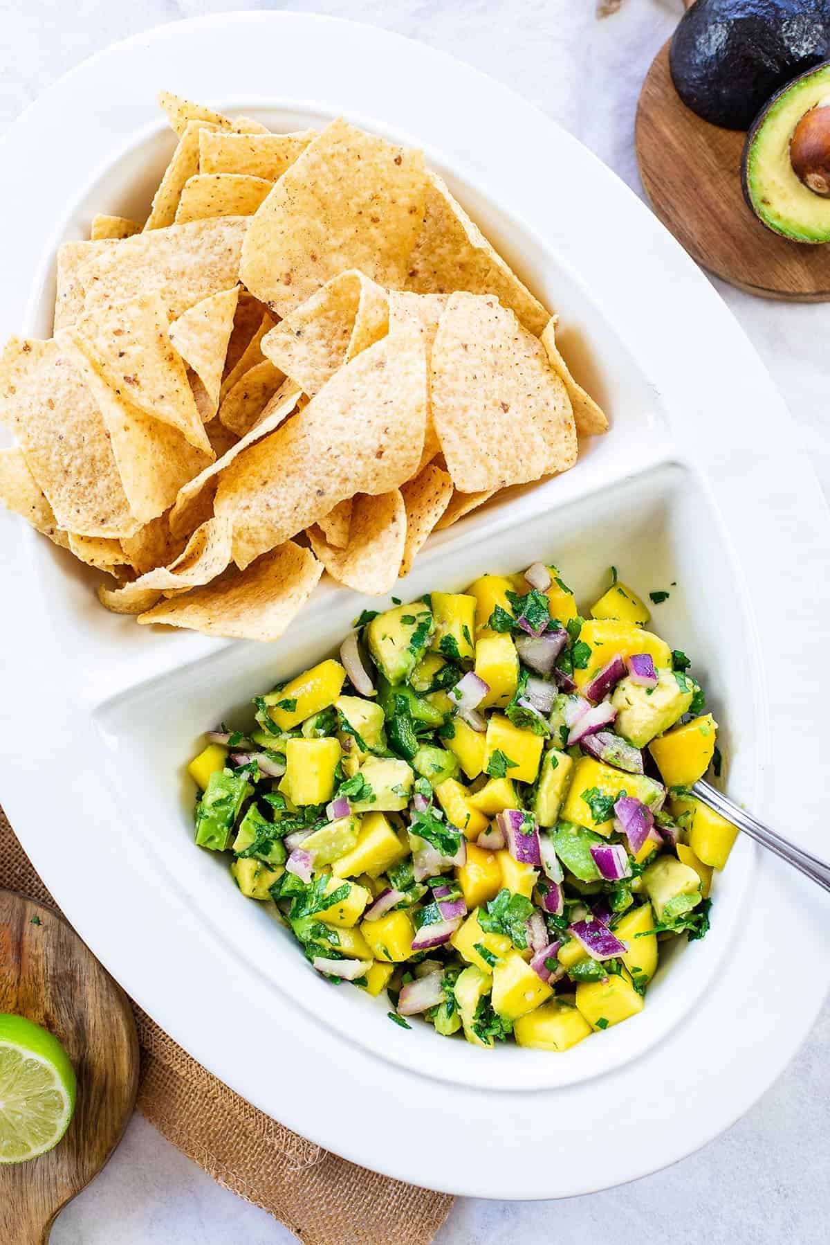 mango avocado salsa in white bowl.