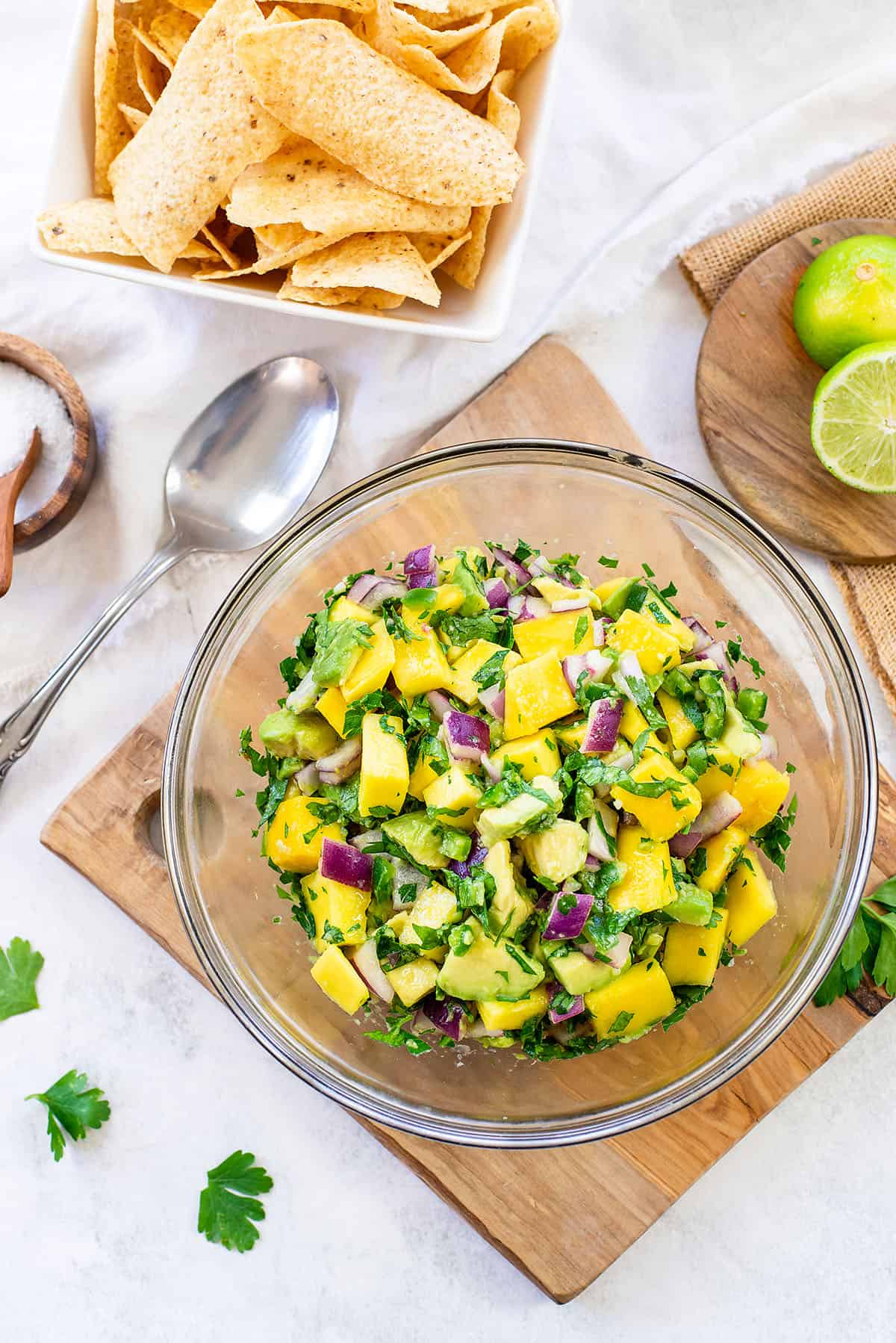 avocado mango salsa in glass bowl.