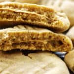 peanut butter stuffed cookies on baking sheet.