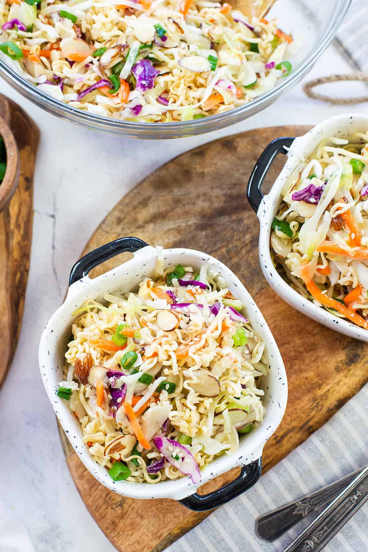 crunchy ramen salad in small white bowls.