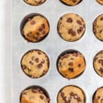 Mini banana muffins in muffin tin.
