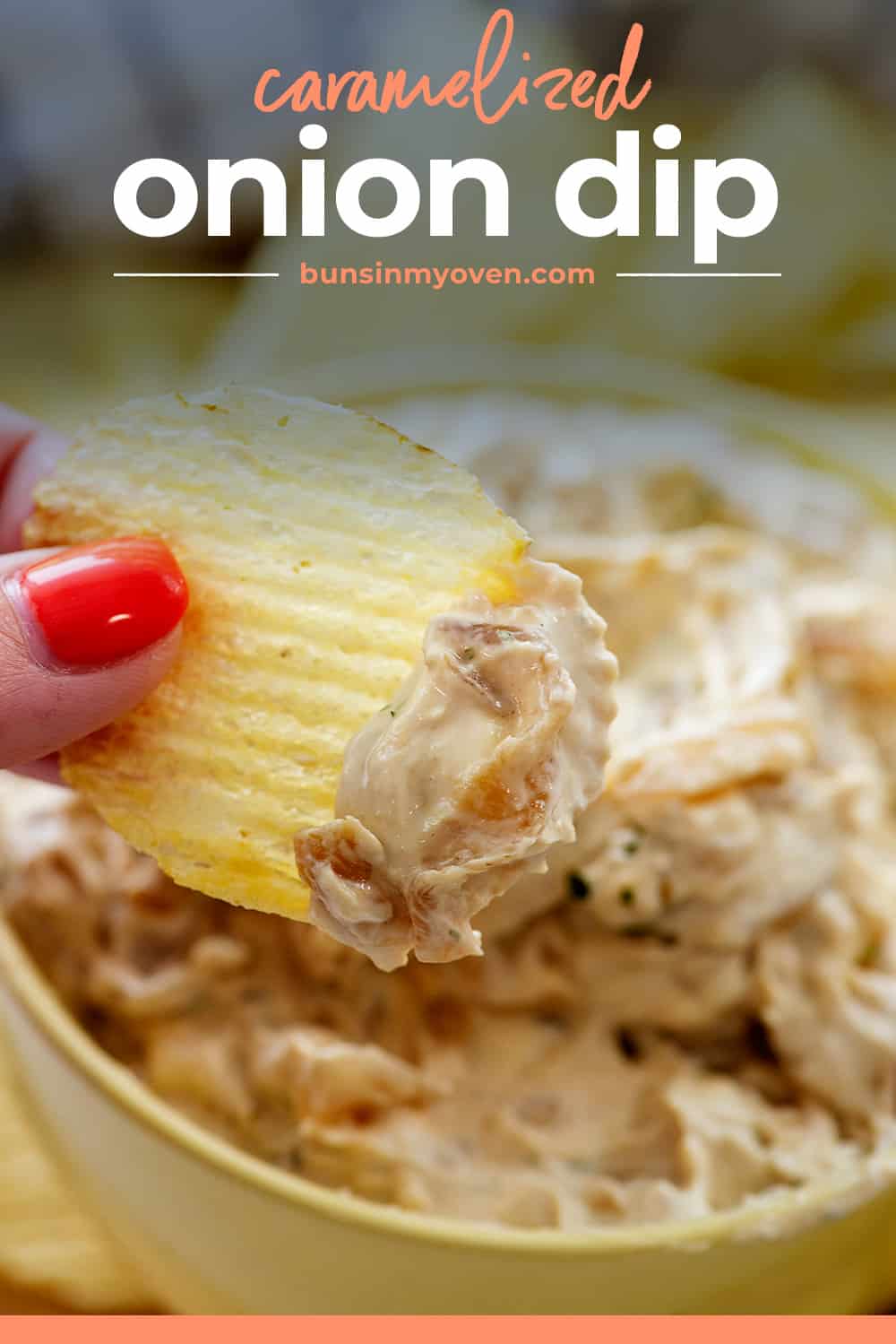 woman dipping a chip into caramelized onion dip.