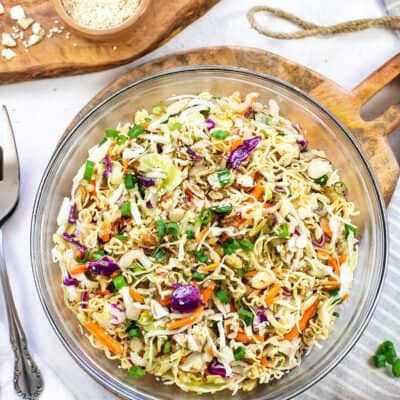 big glass bowl full of Asian ramen salad.