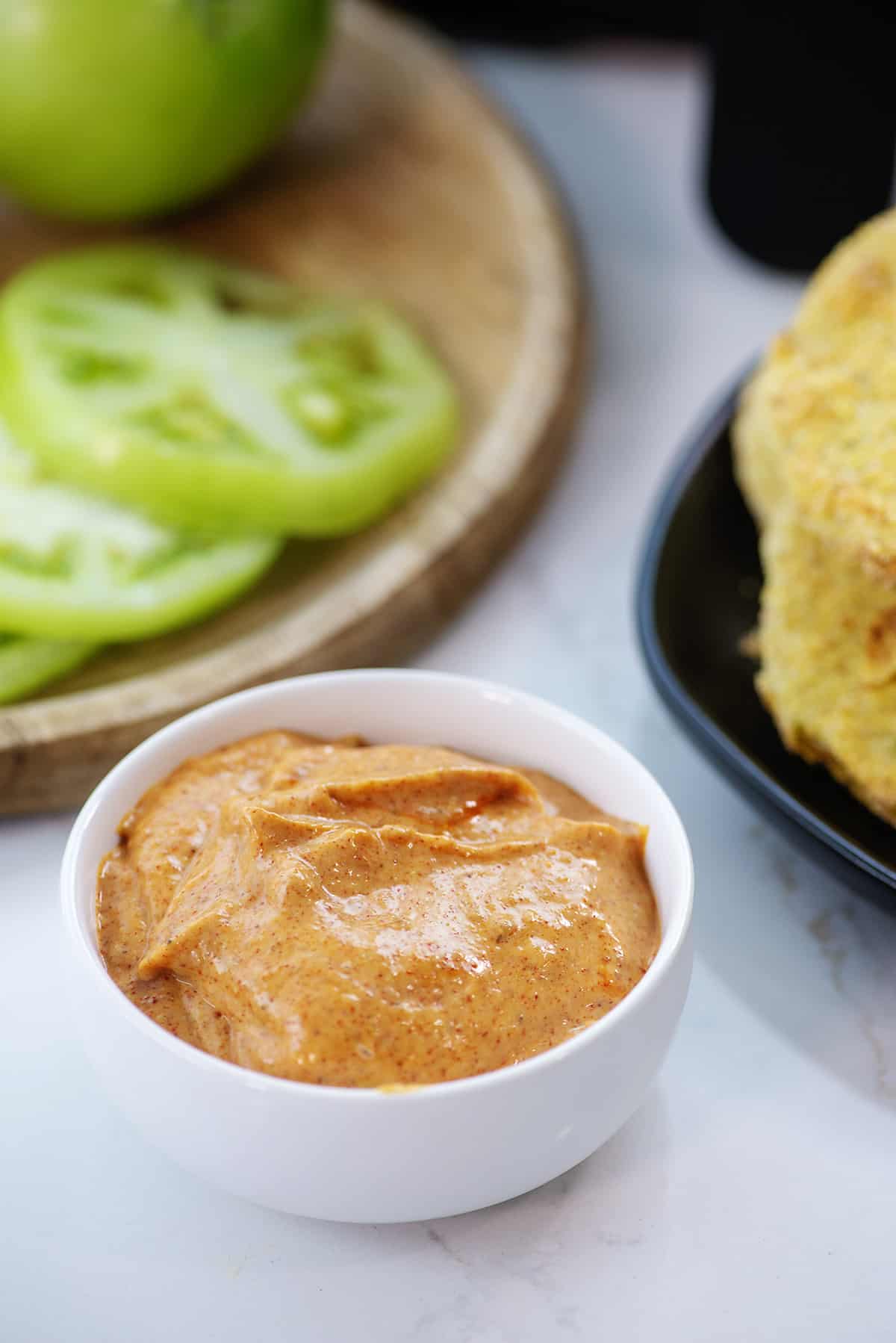 dipping sauce for fried green tomatoes in small white bowl.