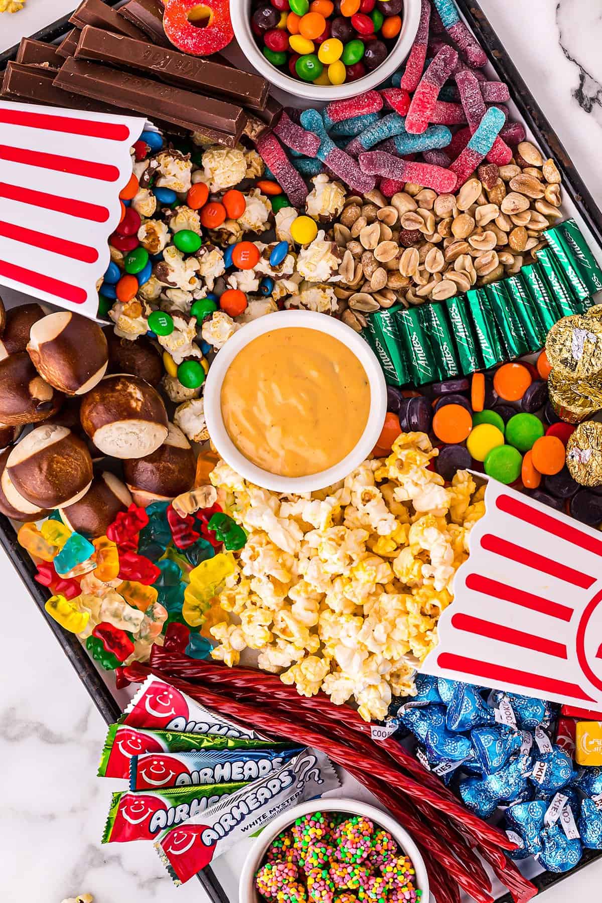 candy and snacks on tray.