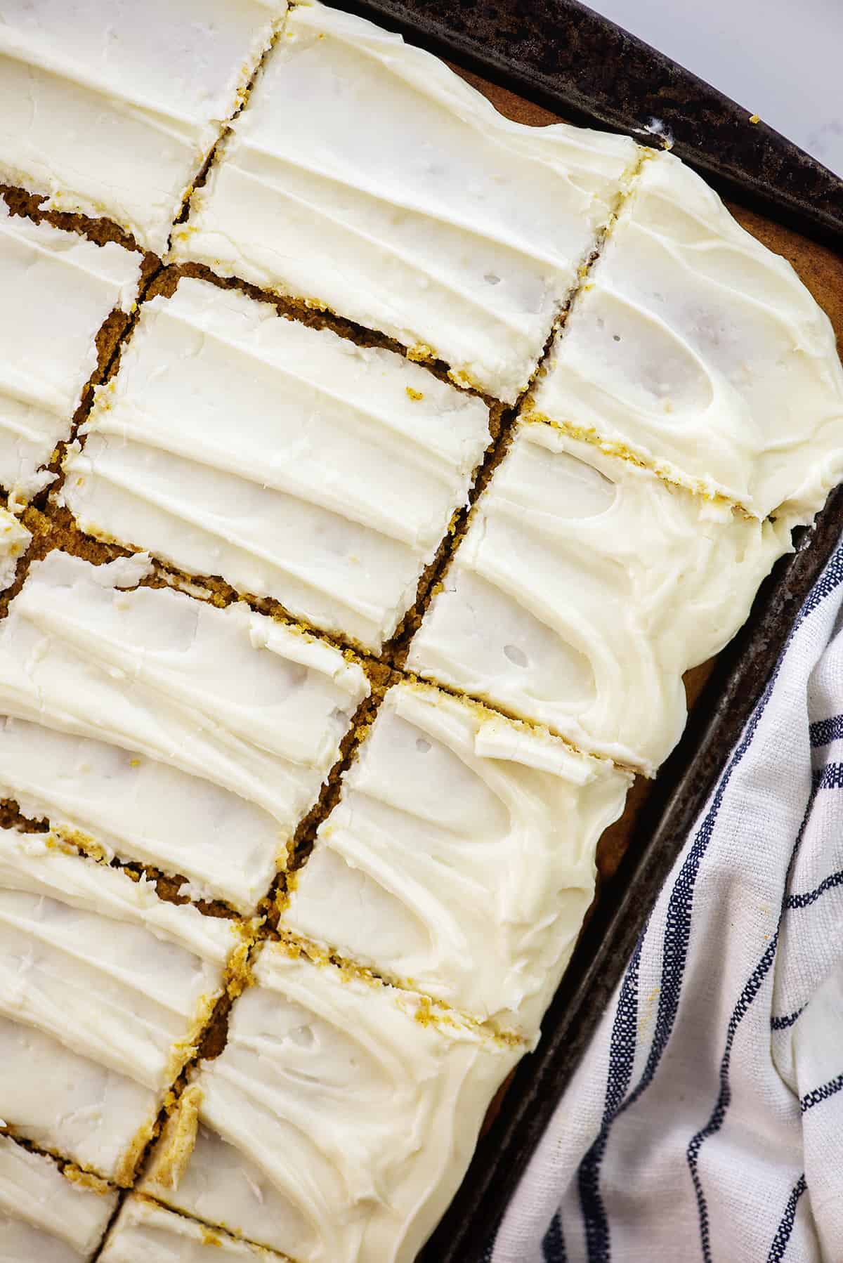 pumpkin bars topped with cream cheese frosting.