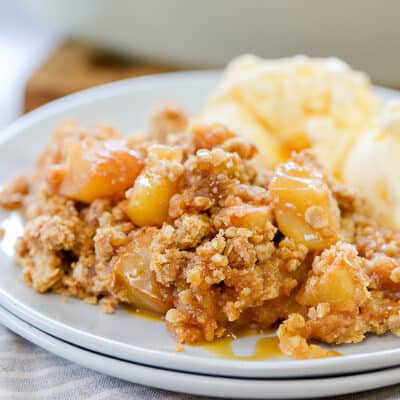 apple crumble on small white plate.