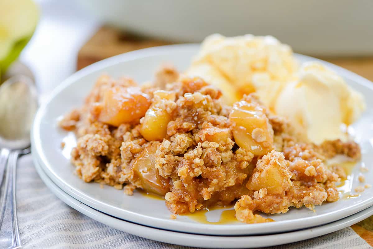 apple crumble on small white plate.