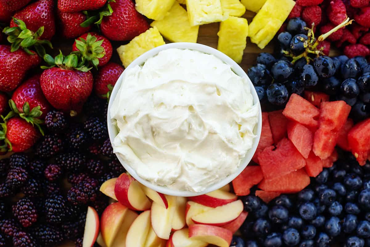 fruit dip with marshmallow fluff surrounded by fresh fruits.