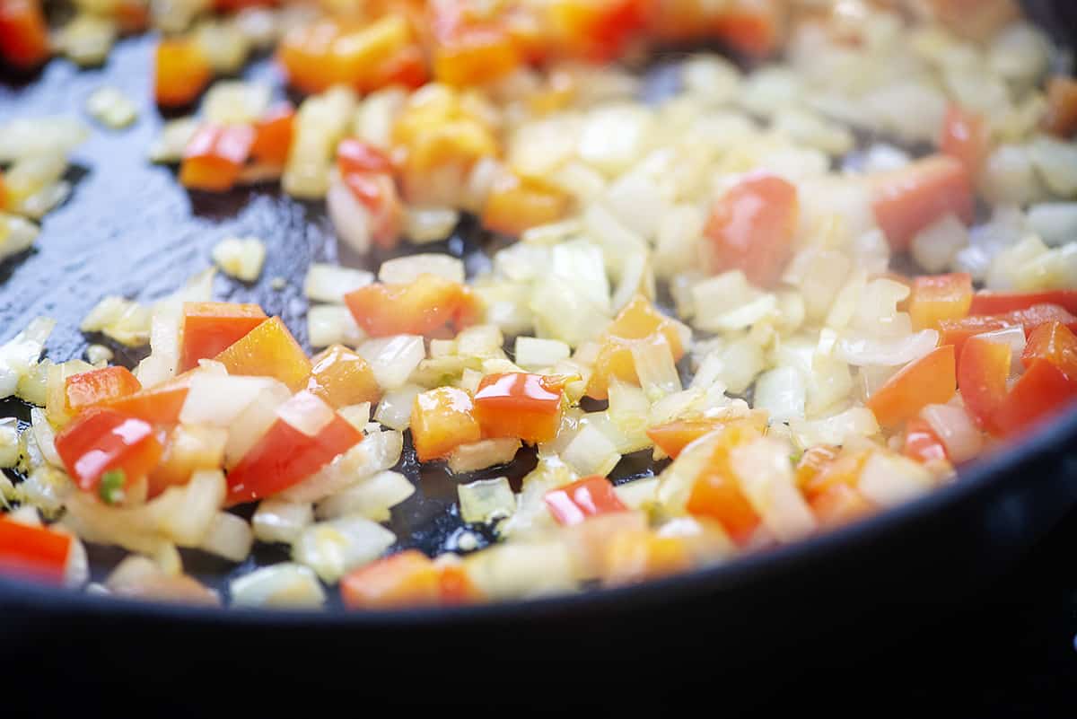 Onions and peppers in skillet.