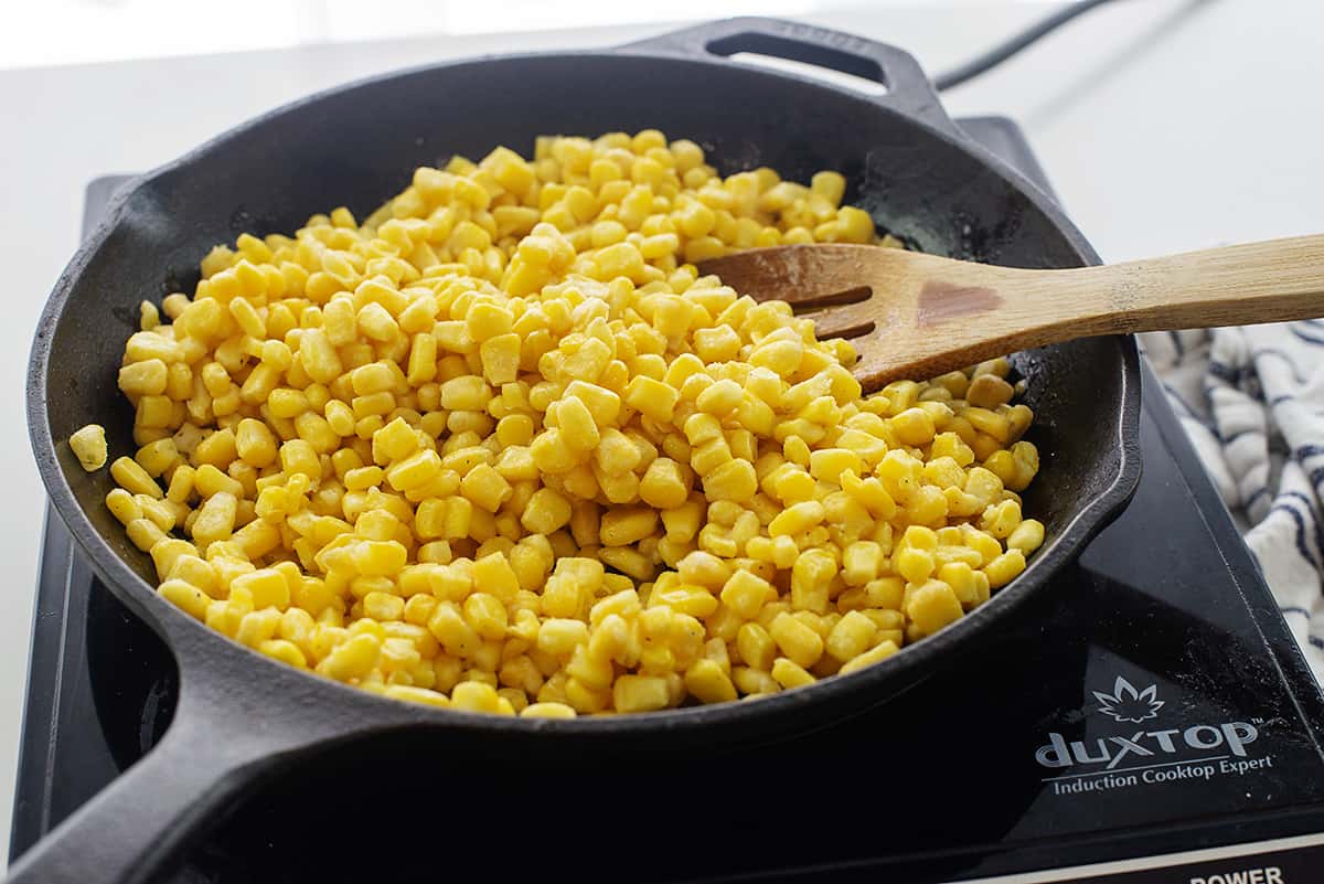 Frozen corn in skillet.