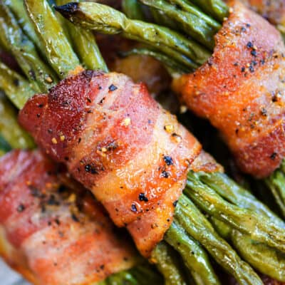 Bacon wrapped green beans on wire rack.