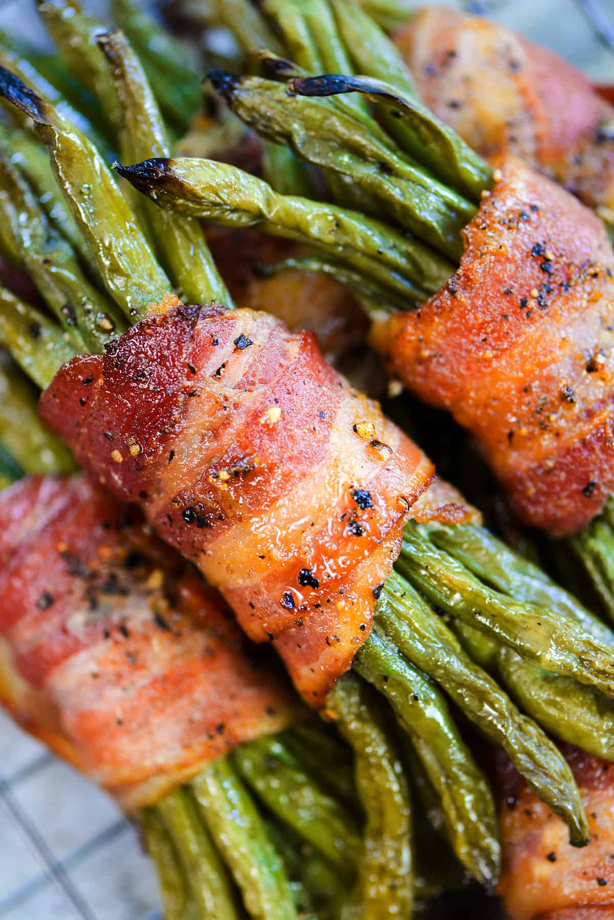 Bacon wrapped green beans on wire rack.