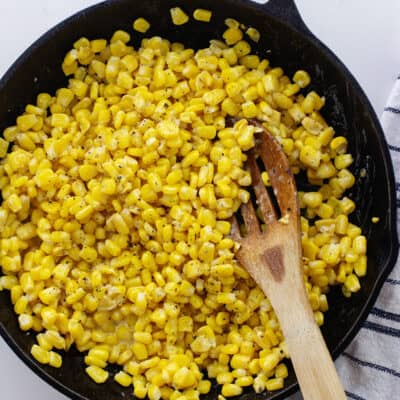 Skillet with corn inside.