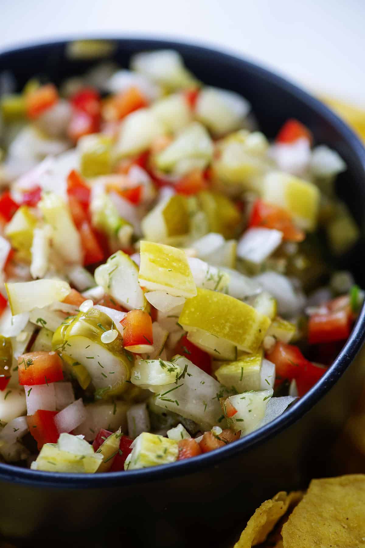 pickle de gallo in black bowl.