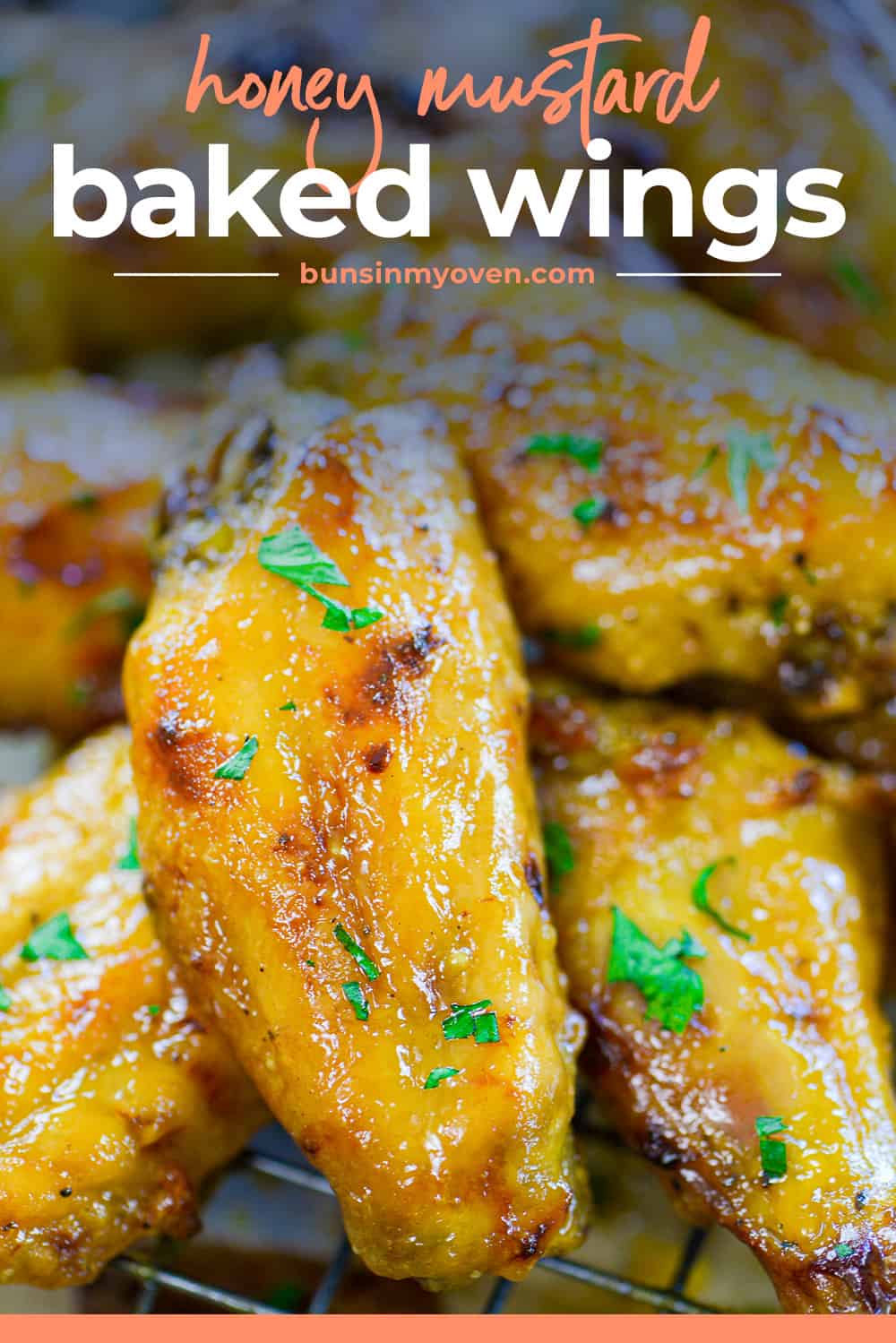 Honey mustard baked chicken wings in a pile.