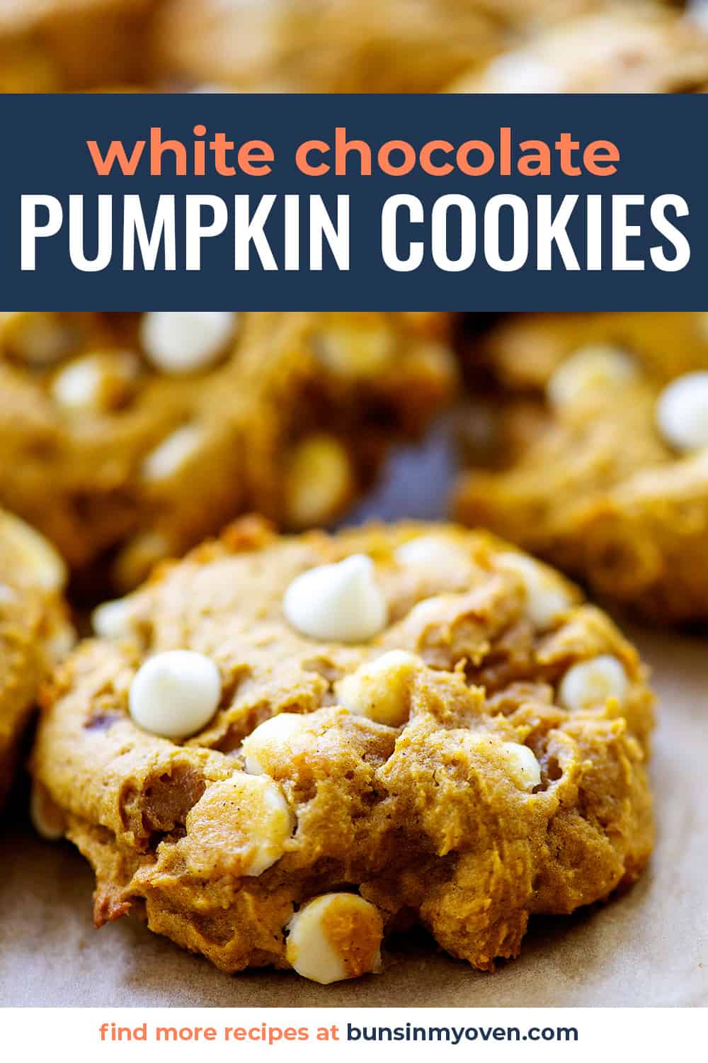 white chocolate chip pumpkin cookies piled together on baking sheet.