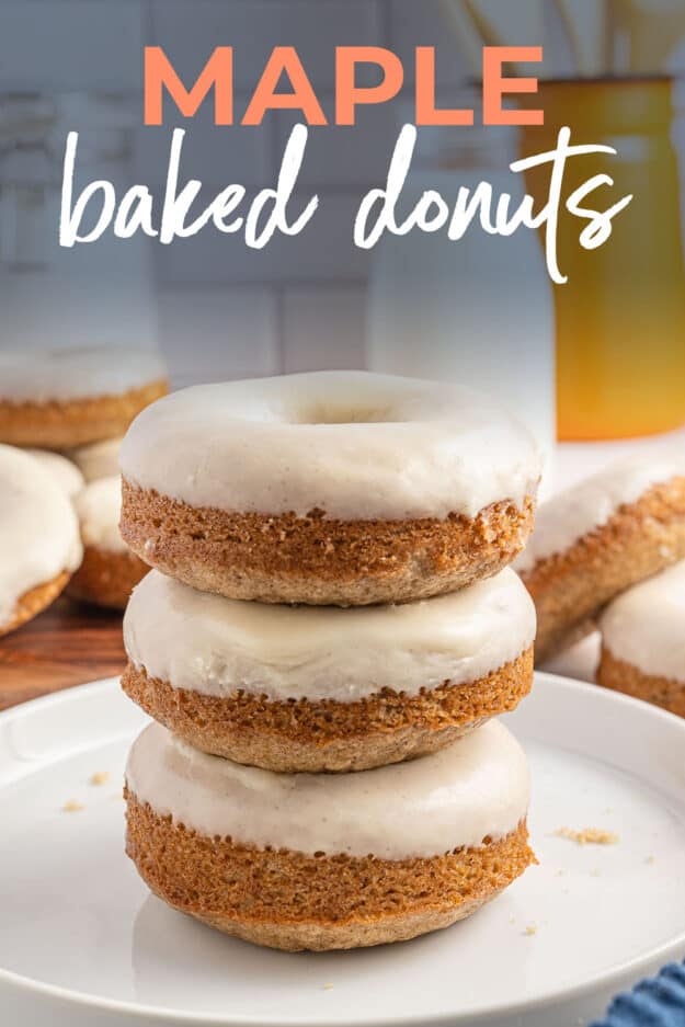 stack of maple glazed donuts on white plate with text for pinterest.