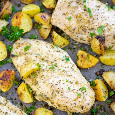 sheet pan chicken and potatoes on baking sheet.