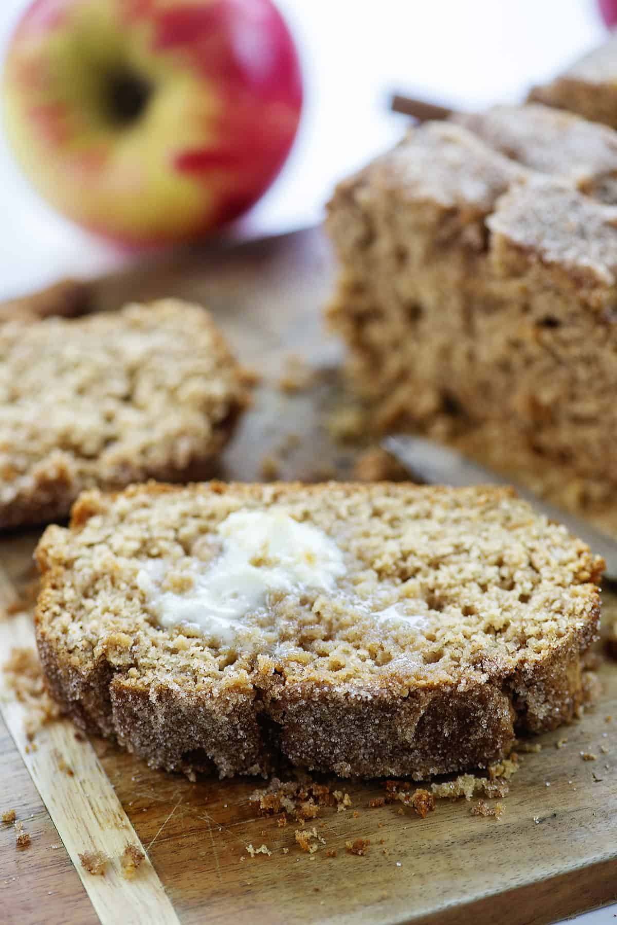 slice of apple cider bread with butter on top.