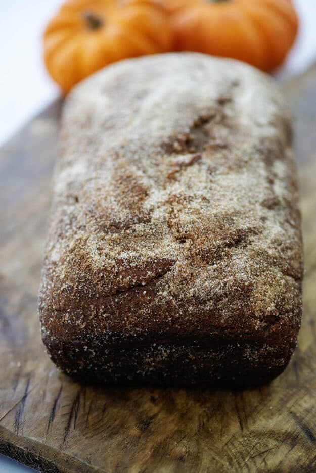 Pumpkin bread topped with cinnamon and sugar.