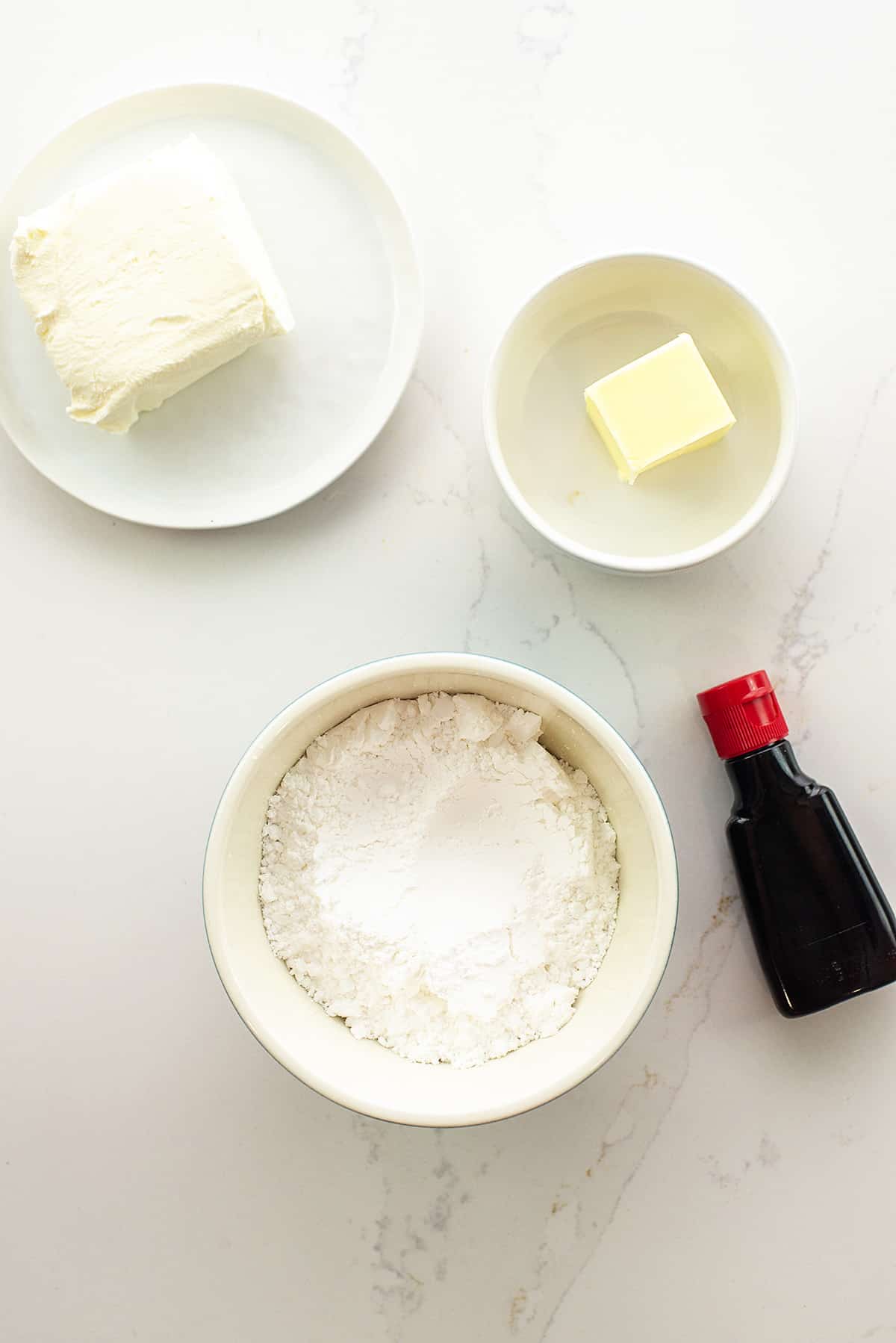 Ingredients for cream cheese glaze on counter.