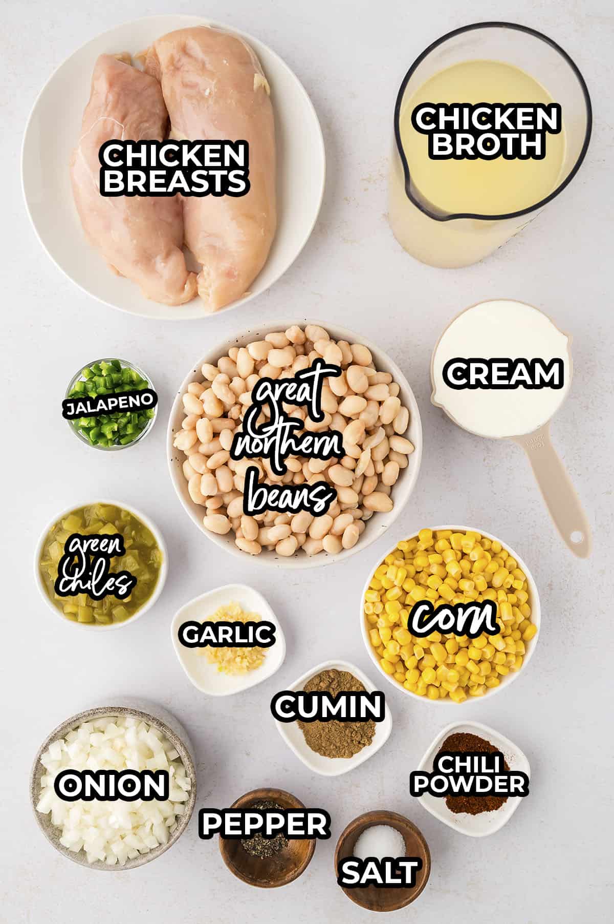 Ingredients for crockpot white chicken chili in individual dishes on counterop.