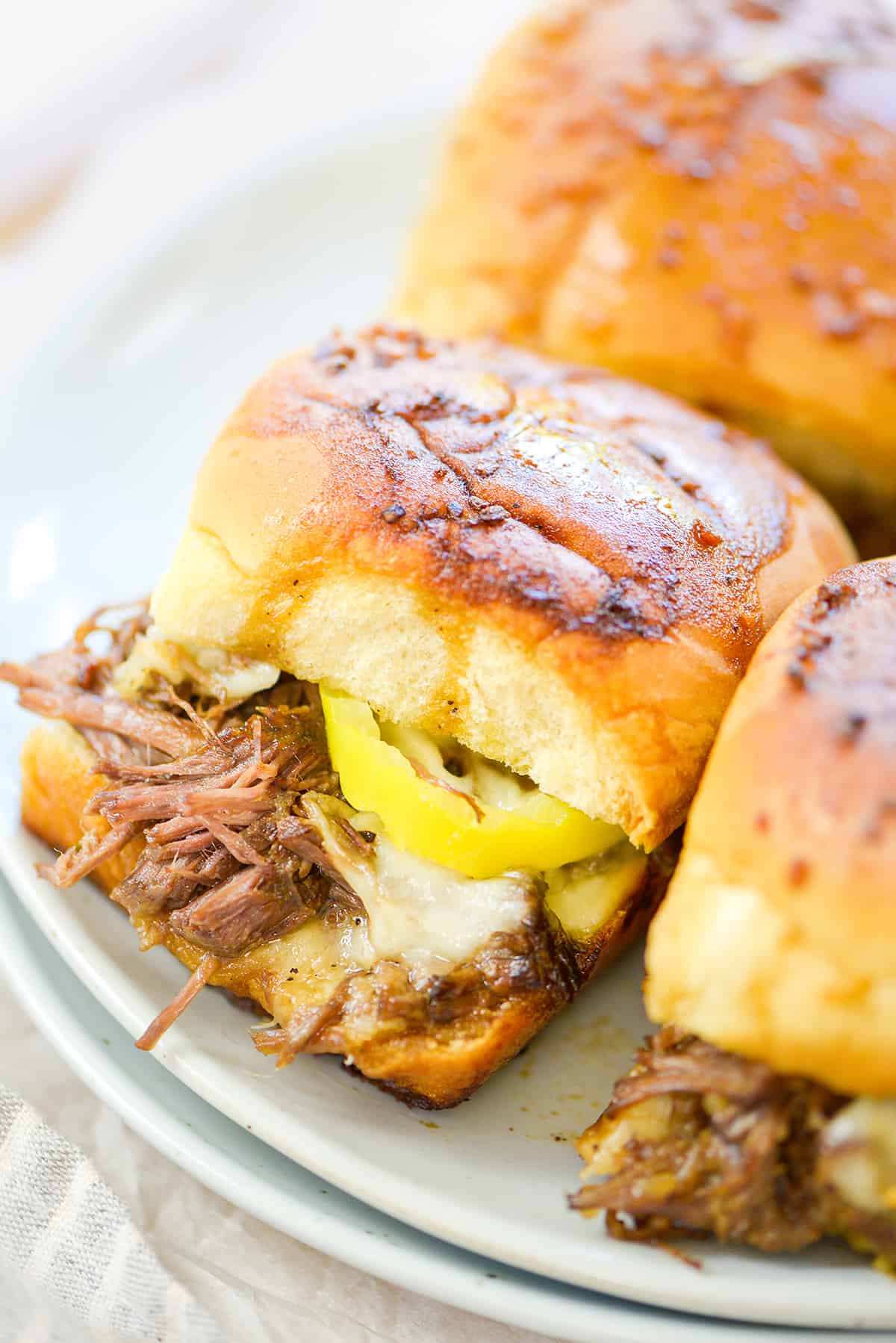 Mississippi sliders on white plates.