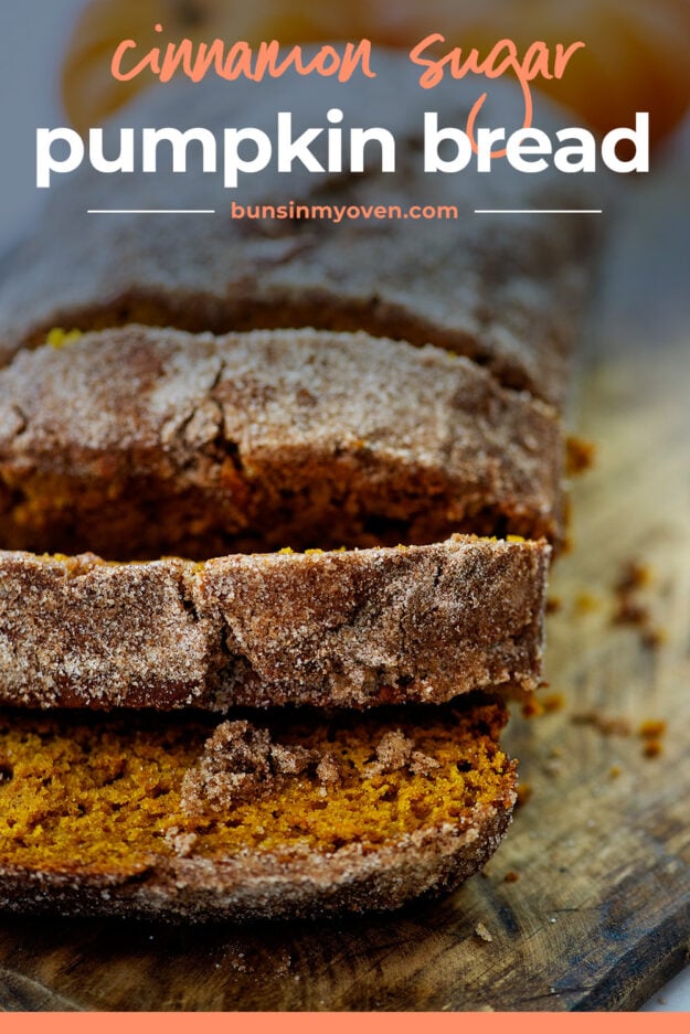 Loaf of pumpkin bread sliced into pieces on cutting board.