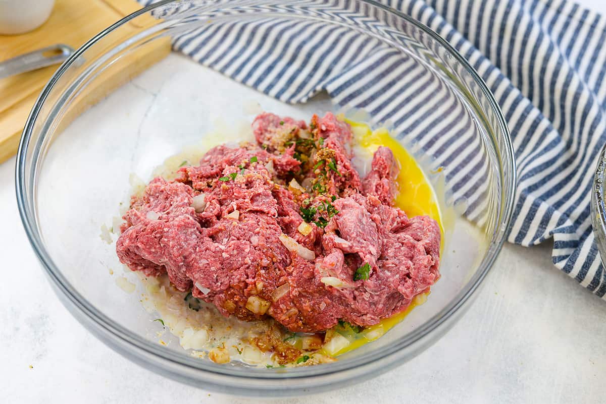 Bowl full of meatloaf ingredients.