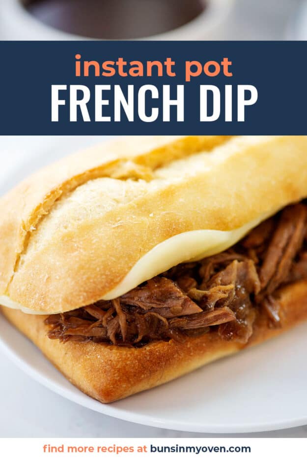 French dip sandwich on white plate.