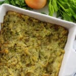 potato stuffing in white baking dish.