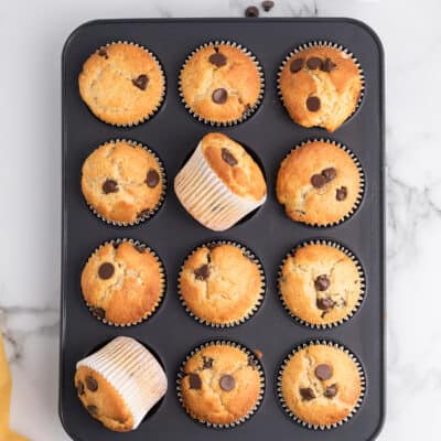 Muffin tin full of cake mix muffins.