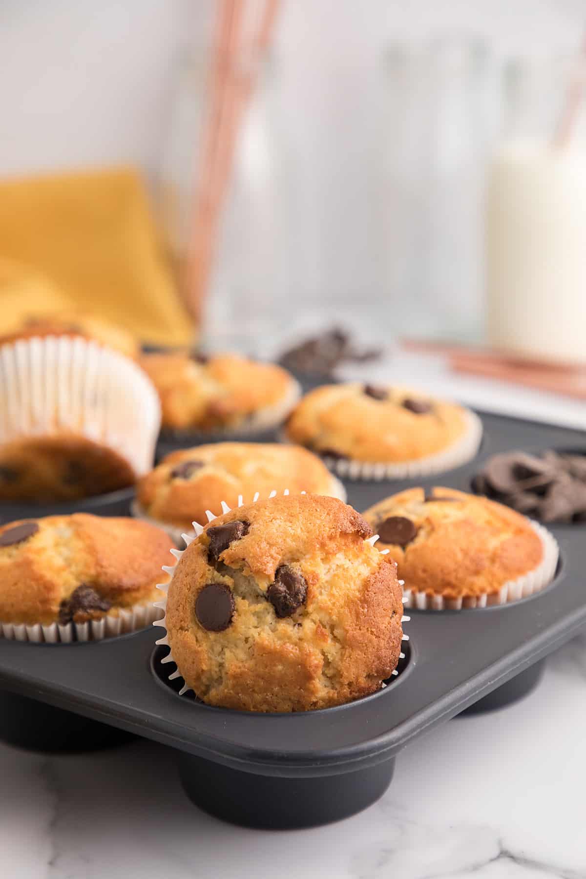 Chocolate chip cake mix muffins in muffin tin.