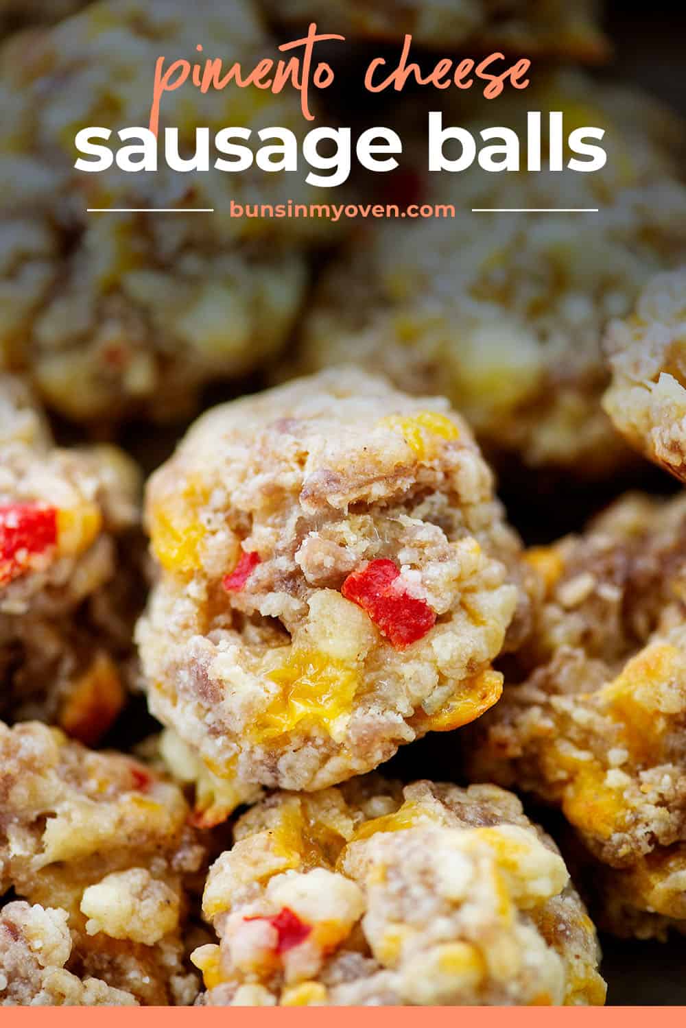 Pimento cheese sausage balls piled together with text for Pinterest.