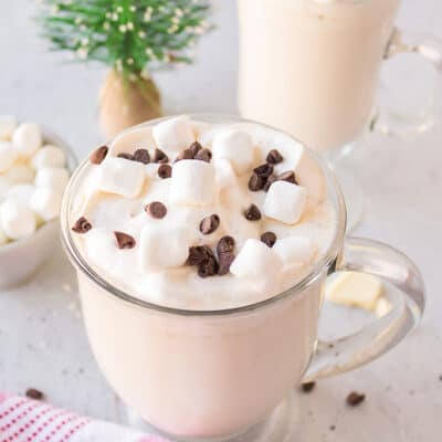 Marshmallows and chocolate chips on a cup of hot chocolate.
