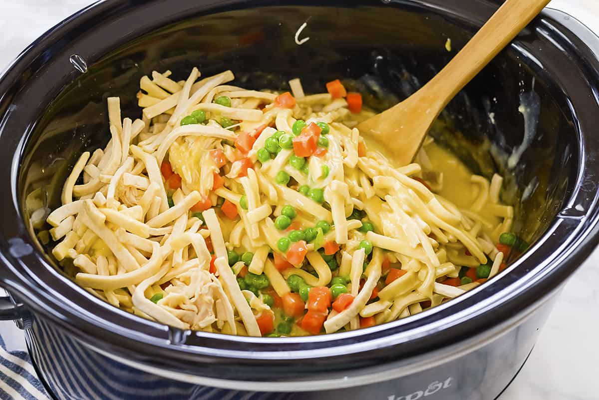 Vegetables and noodles in crockpot.