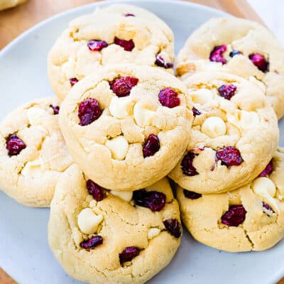 White chocolate cranberry cookies on plate.